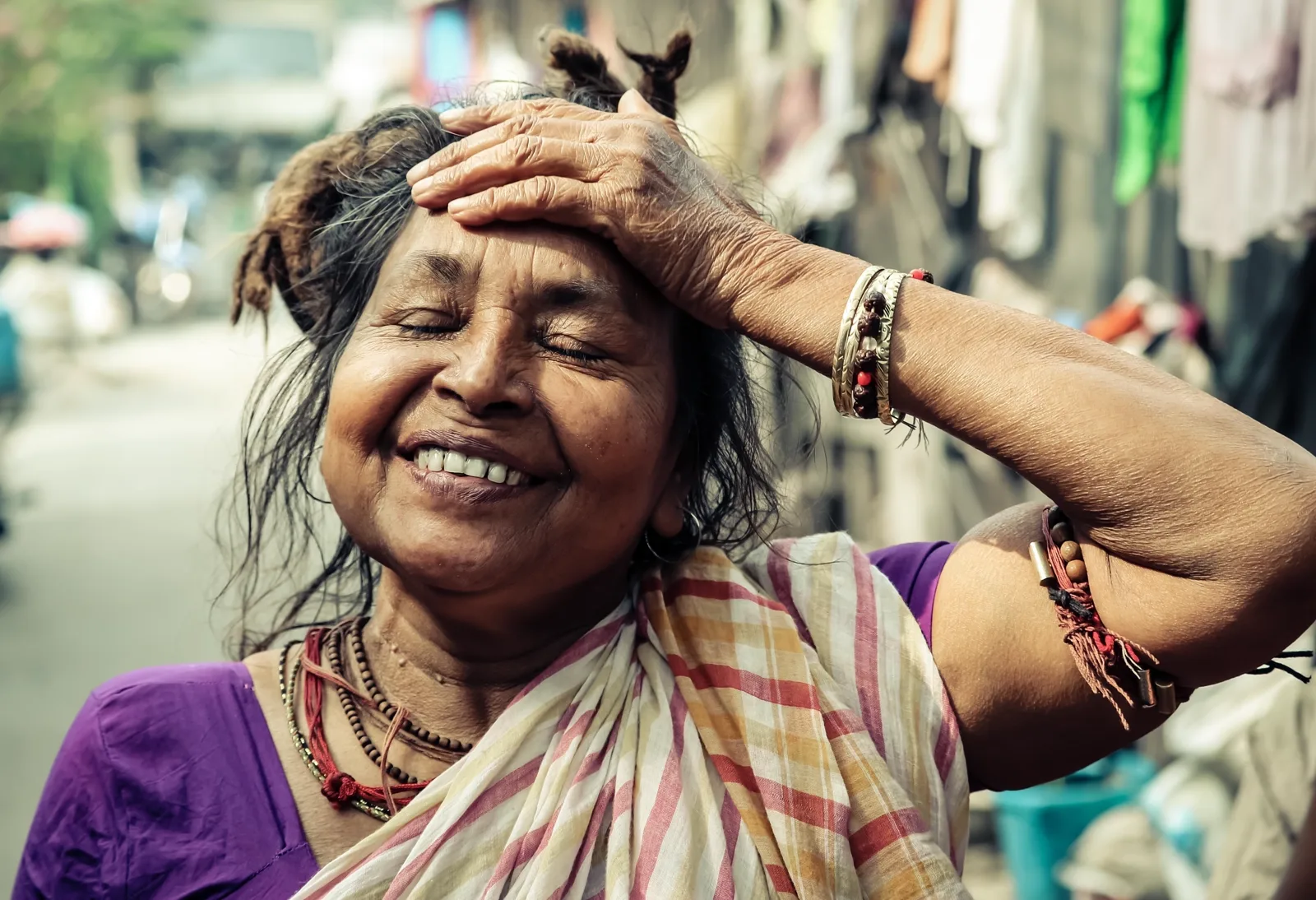 A woman smiling outdoors